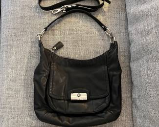 H92 - $55. Black Coach Kristin Hobo Purse. Outside shows some wear. Inside has some staining.
