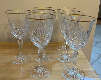 H87 - $80. 7 Piece Set. Miller Rogaska Gold Rim Water Goblets. Measures 8" Tall. Minor wear on gold.
