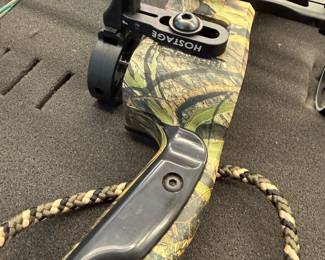 H115 - $200. 2008 Red Head Kronik Compound Bow with Case and Arrows. NEEDS to be restrung.