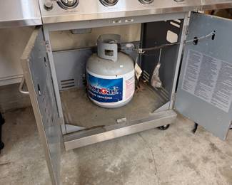H109 - $150. Nexgrill 4 Burner with Cover and Propane Tank.