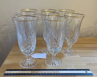 H86 - $80. 8 Piece Set. Miller Rogaska Gold Rim Iced tea Glasses. Measures 7.25" Tall. Minor wear on gold.