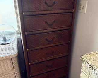 vintage dark brown woven rattan tallboy chest of drawers featuring stacked drawers