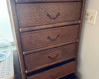 vintage dark brown woven rattan tallboy chest of drawers featuring stacked drawers