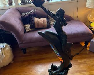 Tiffany-style stained glass floor lamp featuring a sculptural figure of a woman riding a dolphin, topped with a colorful mosaic bowl shade 4Ft tall