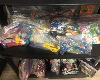 Bags of vintage PEZ dispensers. 