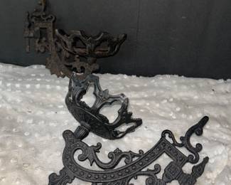 Cast metal wall sconces