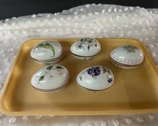 collection of vintage porcelain egg-shaped trinket boxes Floral pattern