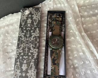 Infantry military-style tactical wristwatch with a camouflage strap