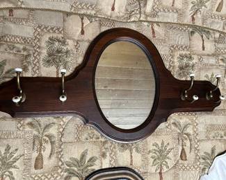 Hanging mirror with hooks