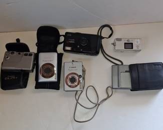 Collection of Vintage Digital and Film Cameras with GPS Device