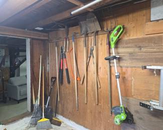 Assorted Garden Tool Collection with Storage Rack