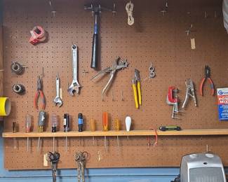 Assorted Hand Tool Collection on Pegboard