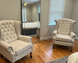 pair of wing chairs white material