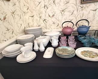 Assorted Tableware Collection with Cast Iron Teapots and Decorative Plates