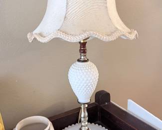Vintage Fenton-style hobnail milk-glass table lamp with a ruffled shade, paired with a colorful retro floral ceramic piece charming finds for vintage décor lovers! ✨