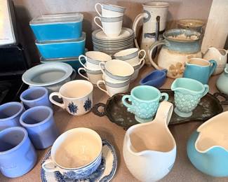 Charming collection featuring vintage Pyrex refrigerator dishes, Blue Willow china, pastel mugs, teacups, creamers, and pitchers perfect for collectors and colorful kitchen displays! 🩵✨