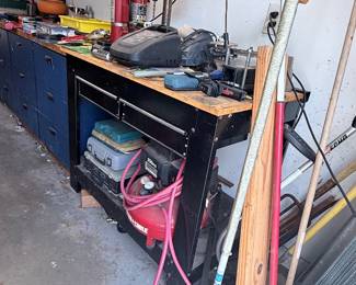 Garage workshop finds include a benchtop drill press, rolling tool cabinet and workbench, power tools, hand tools, air hoses, lumber, and assorted hardware! 🛠️✨