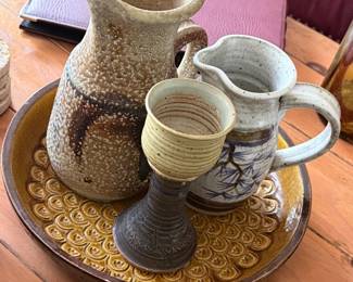 Charming collection of handmade studio pottery featuring rustic pitchers, a goblet, and a beautifully textured serving platter perfect for pottery collectors or warm, earthy décor! 🏺✨
