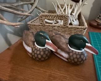 Pair of decorative mallard duck decoys alongside a basket filled with antler sheds charming rustic accents for the outdoorsman or lodge décor collector! 🦆🦌