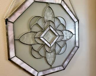 Elegant octagonal stained-glass wall hanging with soft lavender accents and intricate beveled detailing