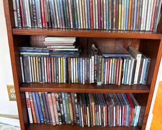 CD collection on bookshelf