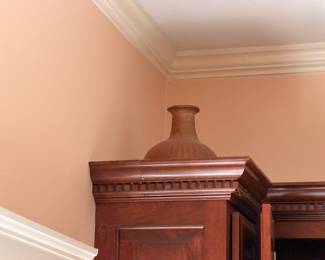 Pottery vase on cabinet top