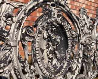 Ornate cast iron bench back scrollwork detail