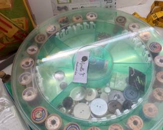 Vintage thread spools and buttons in case