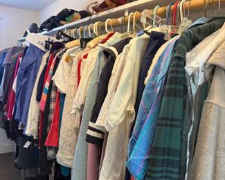 Men's closet with shirts, slacks and ties