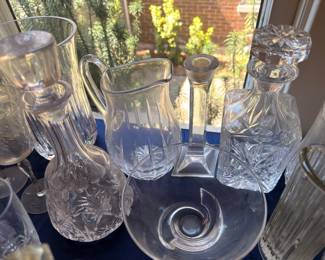 Cut crystal pitcher, decanters and candleholder