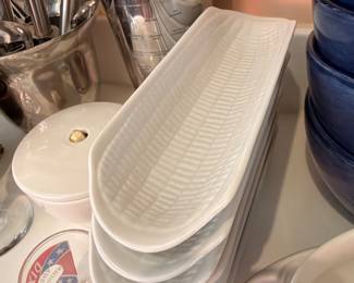 White porcelain baguette dishes and blue bowls