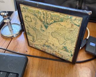 Framed antique world map and desk clock