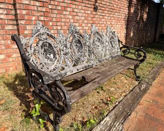 Antique cast iron garden bench, side view