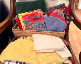 Basket of folded linens, napkins and kitchen towels