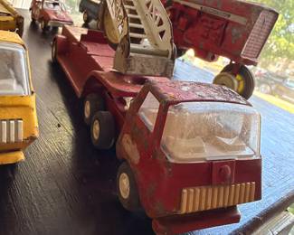 Vintage pressed steel fire truck and toy trucks