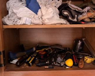 Hand tools, pliers and screwdrivers in cabinet