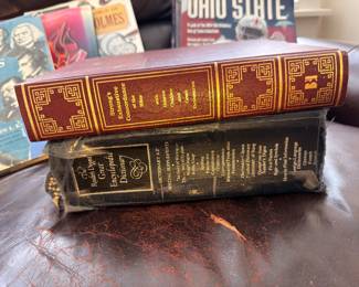 Antique Webster's dictionary and leather-bound book