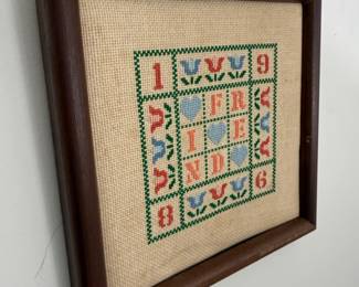 Framed cross-stitch sampler with hearts