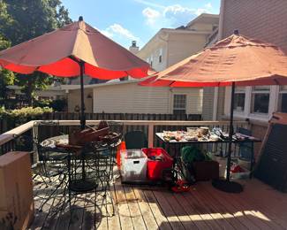 Patio bistro sets with red market umbrellas