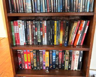 DVD and VHS movie collection on shelves