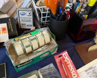 Tape, pens and assorted office supplies