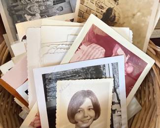 Basket of vintage school portrait photographs