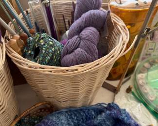 Basket of yarn and knitting needles