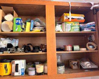 Cabinet of household supplies, batteries and candles