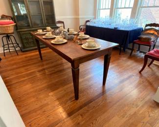 Dining room with farmhouse table and china cabinet