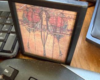 Framed decorative print with red accents
