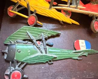 Antique wood model airplanes, green and yellow