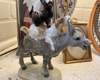 Porcelain donkey and terrier figurine group