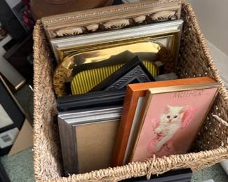 Basket of assorted picture frames