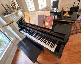 Kawai baby grand piano with sheet music